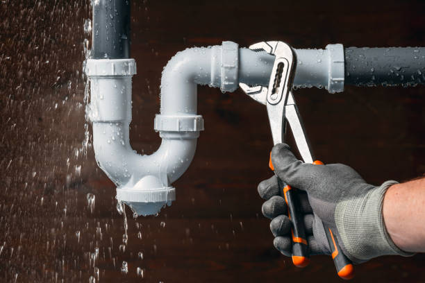 Professional Emergency Plumber technician working in Kalkaska, MI